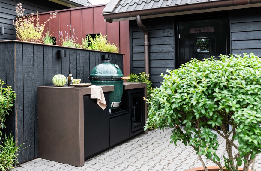 Compact outdoor kitchen with leather-look countertop